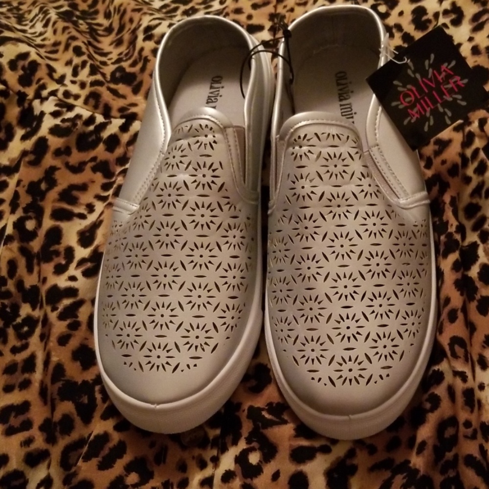 Silver sneakers by Olivia Miller in size 8.